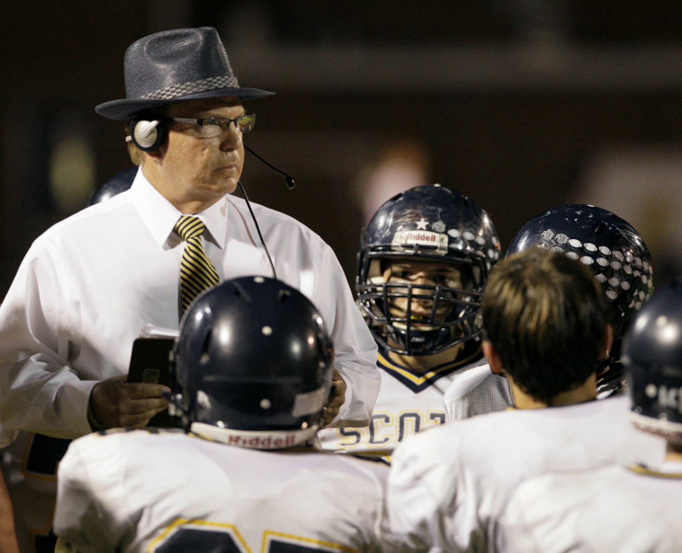 Highland Park High School Head Coach Randy Allen talks with players during a game against...