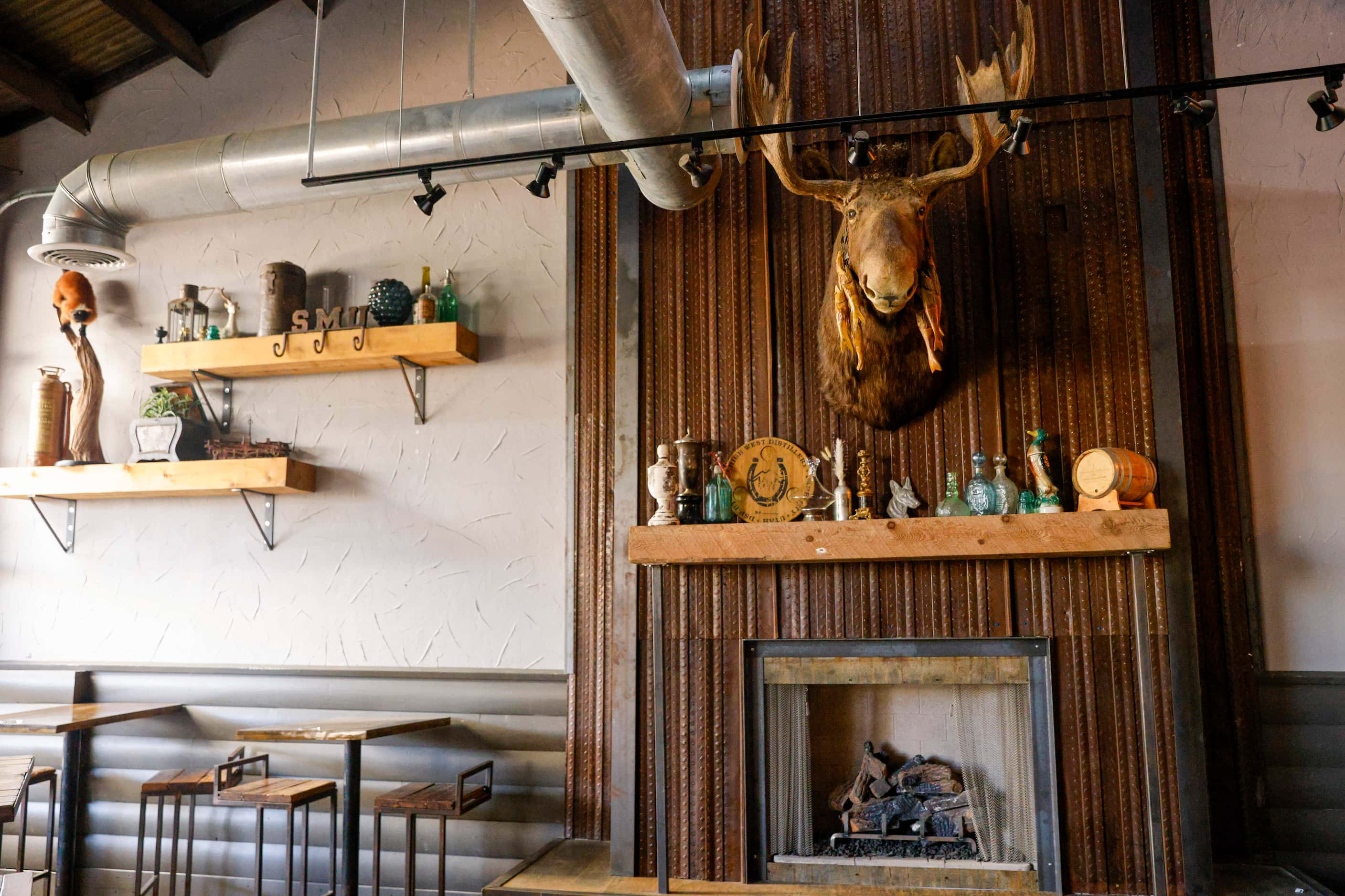 A moose and several other decorations from the old restaurant sit along a wall at Henrys...