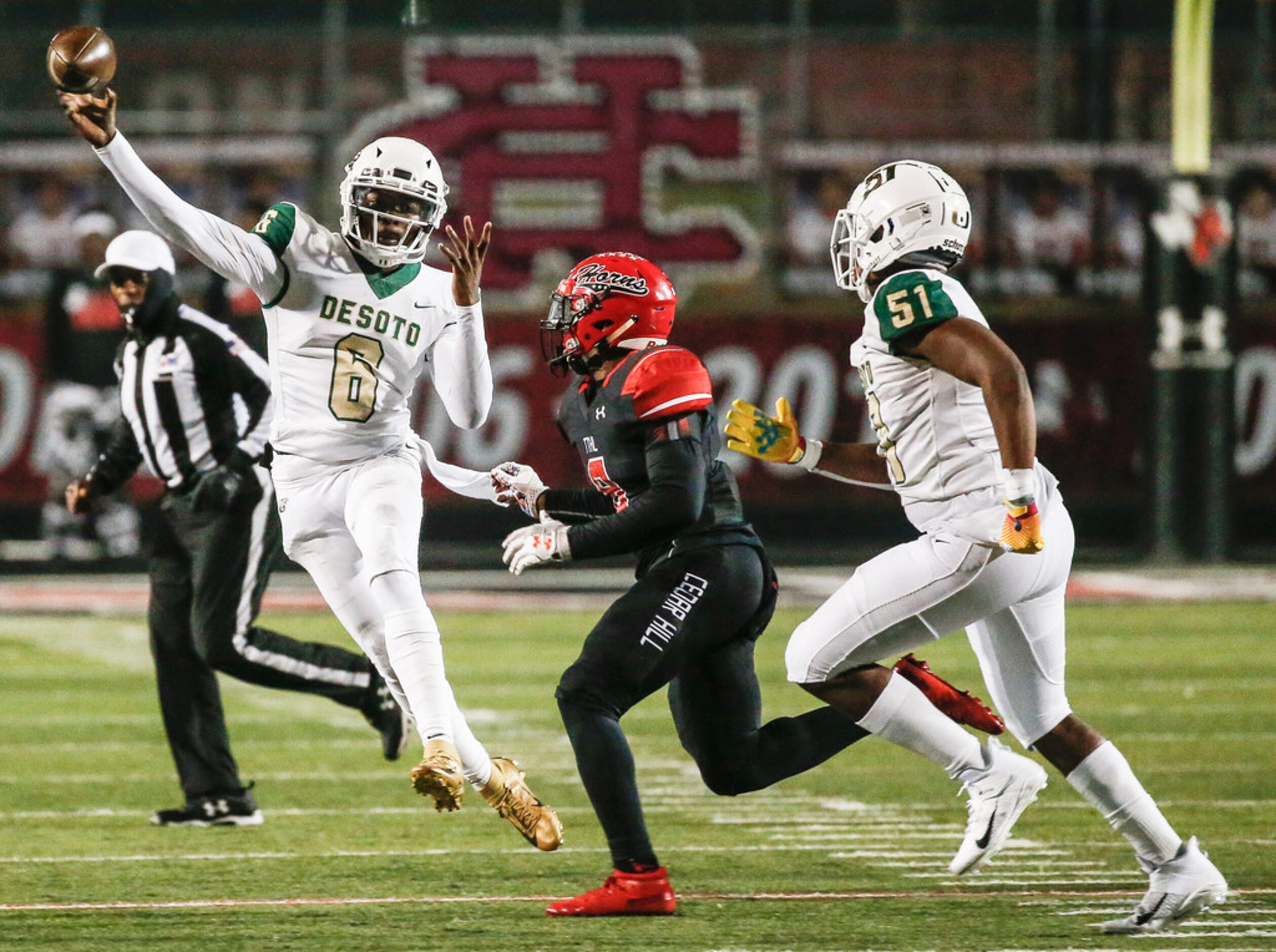 DeSoto quarterback Samari Collier fires off a pass over Cedar Hill linebacker Stefan Ingram...