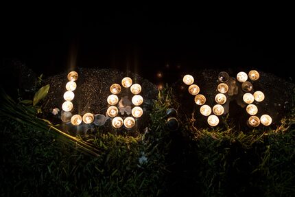  Candles sit on the edge of Lake Eola, June 12, 2016 in Orlando, Florida. The shooting at...