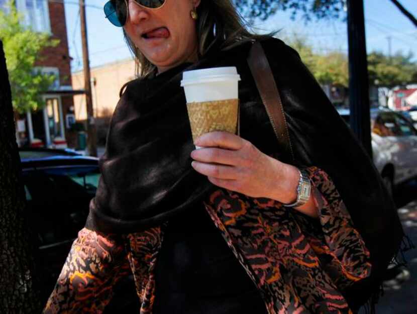 
A woman carried her coffee to go in Bishop Arts on Friday afternoon, March 07, 2014. There...