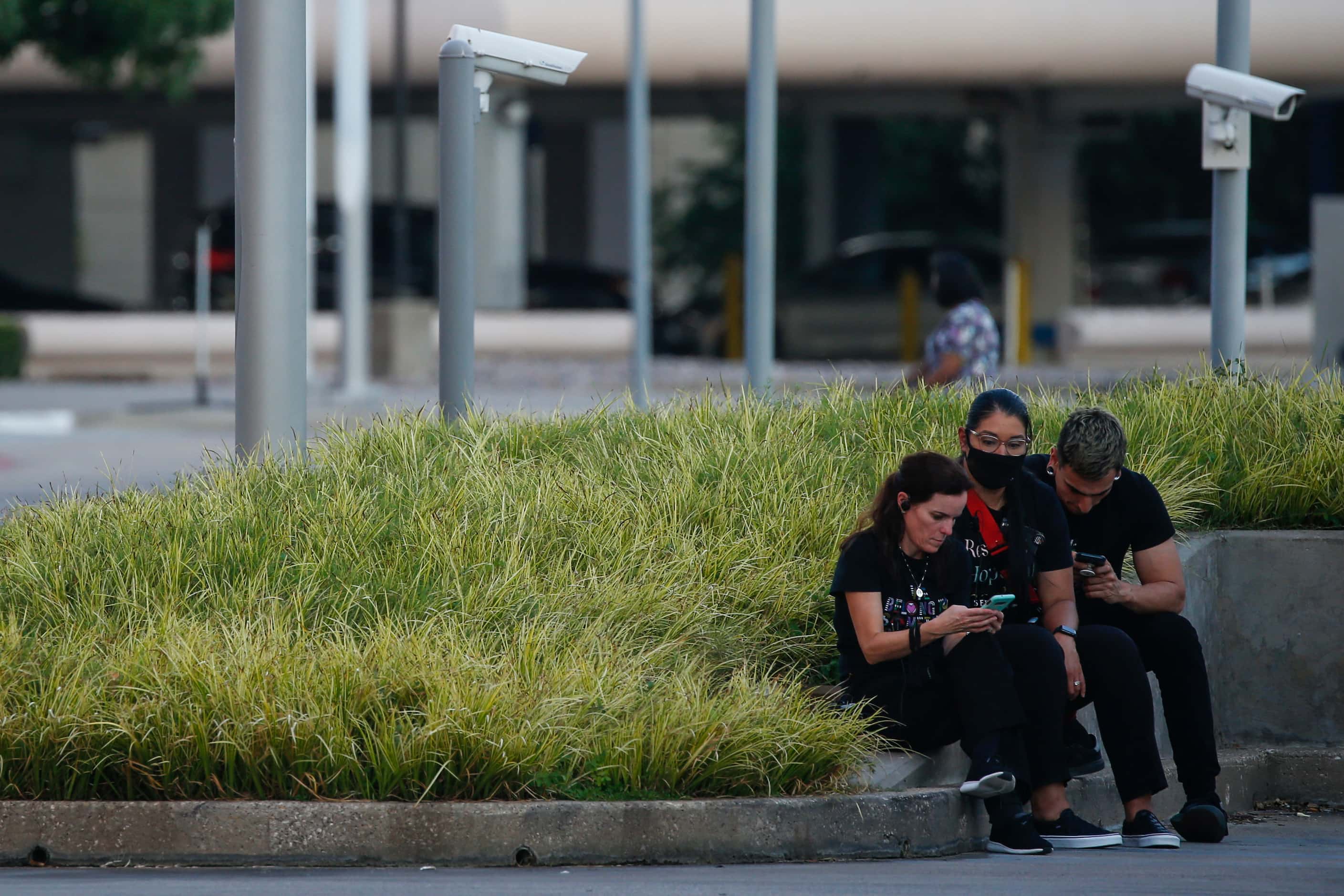 People wait outside of Galleria Mall, where a shooting was reported Tuesday, June 16, 2020...