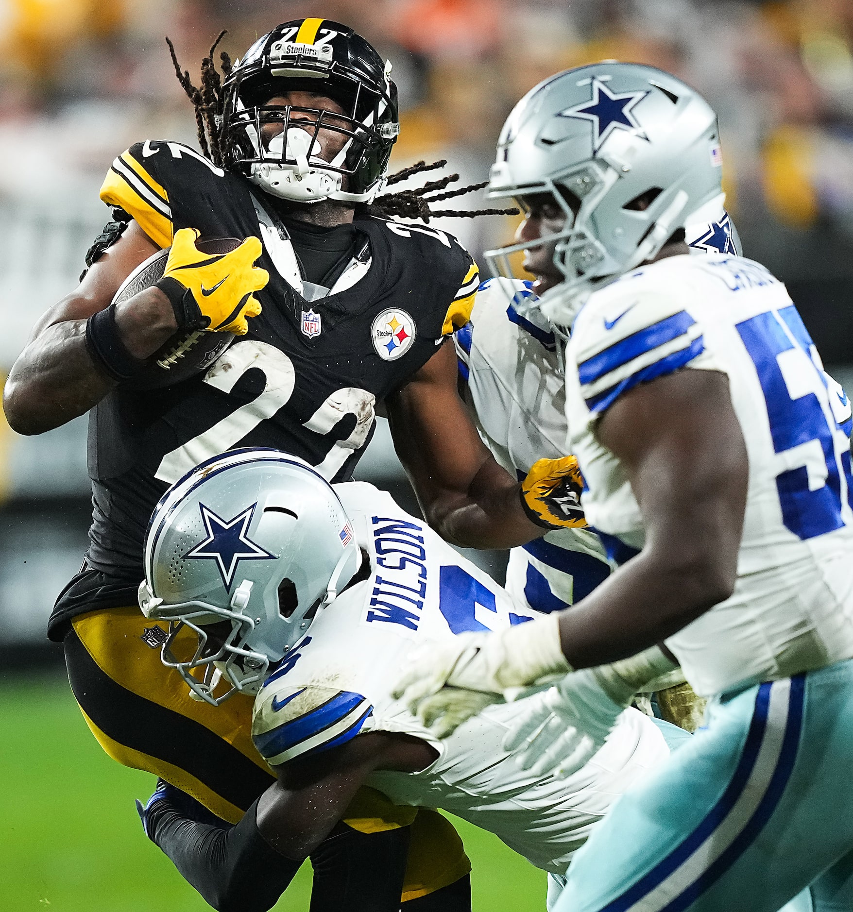 Pittsburgh Steelers running back Najee Harris (22) is brought down by Dallas Cowboys safety...