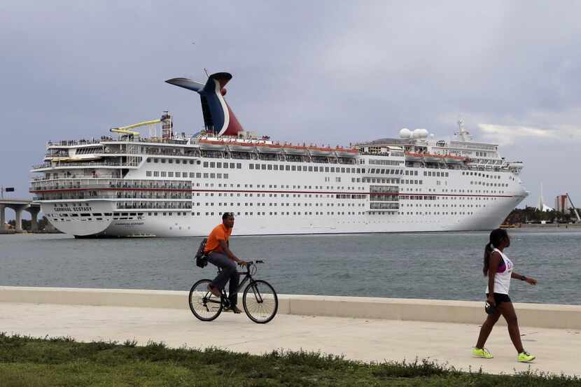A Carnival Cruise ship sits docked in Cuba.