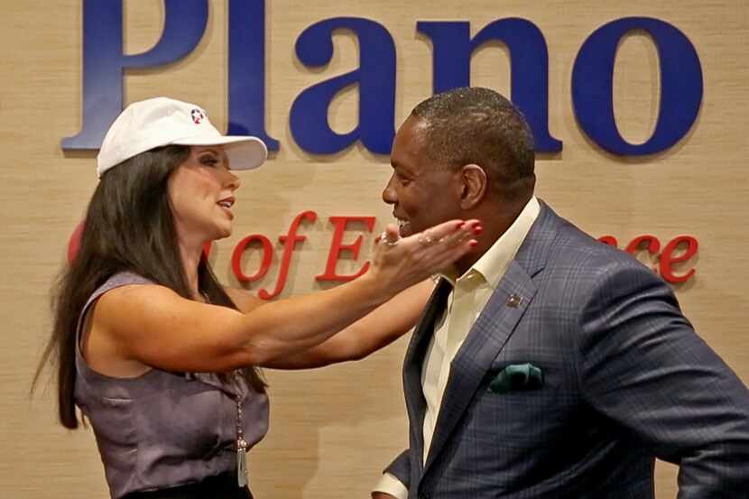 LeeAnne Locken, one of the stars of the "Real Housewives of Dallas,"left, hugs Plano Mayor...