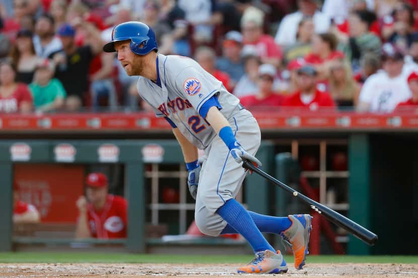 New York Mets' Todd Frazier hits a single off Cincinnati Reds starting pitcher Anthony...