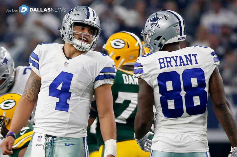 Dallas Cowboys quarterback Dak Prescott (4) talks with wide receiver Dez Bryant (88) during...