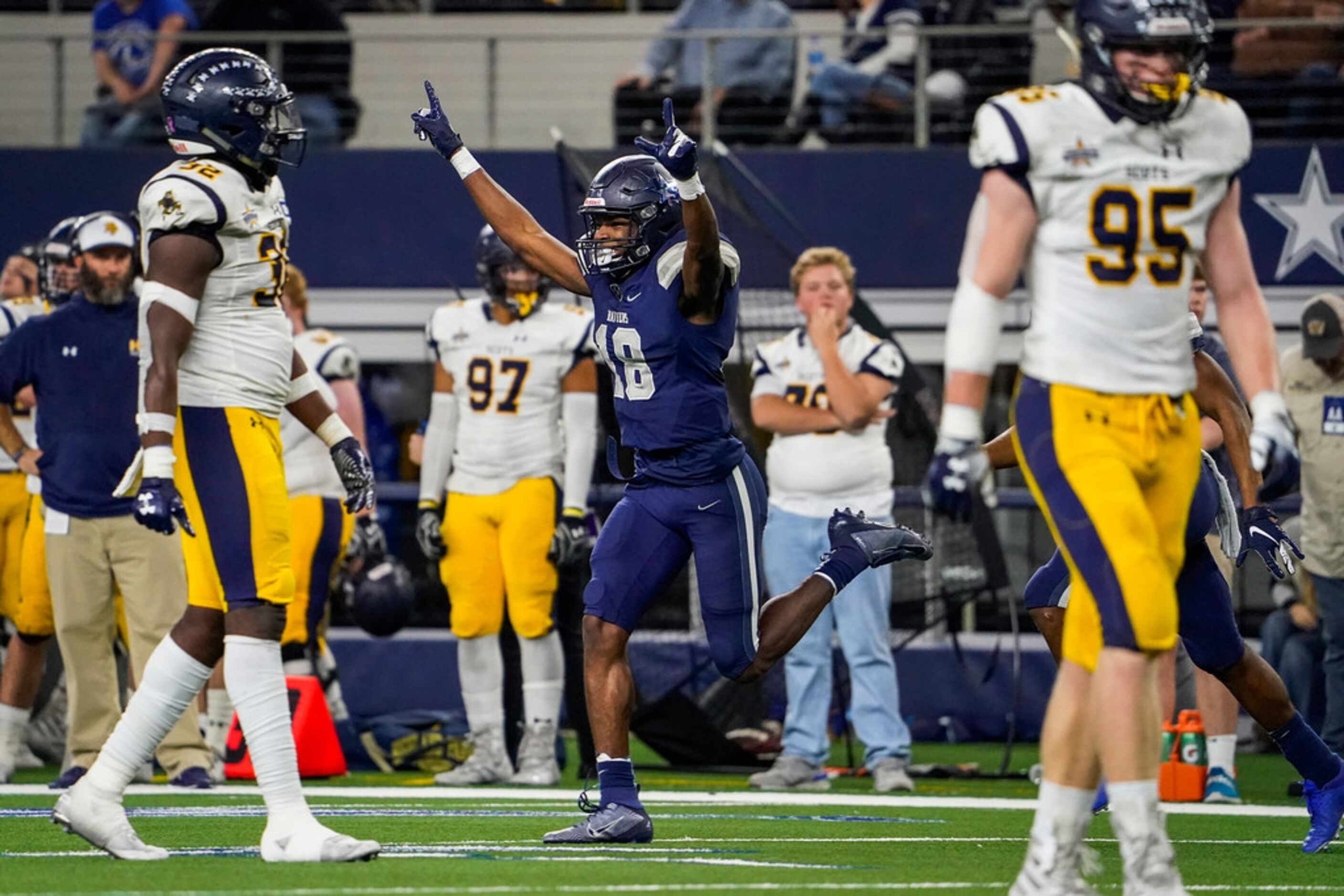 Frisco Lone Star wide receiver Marvin Mims celebrates after catching 16-yard touchdown pass...