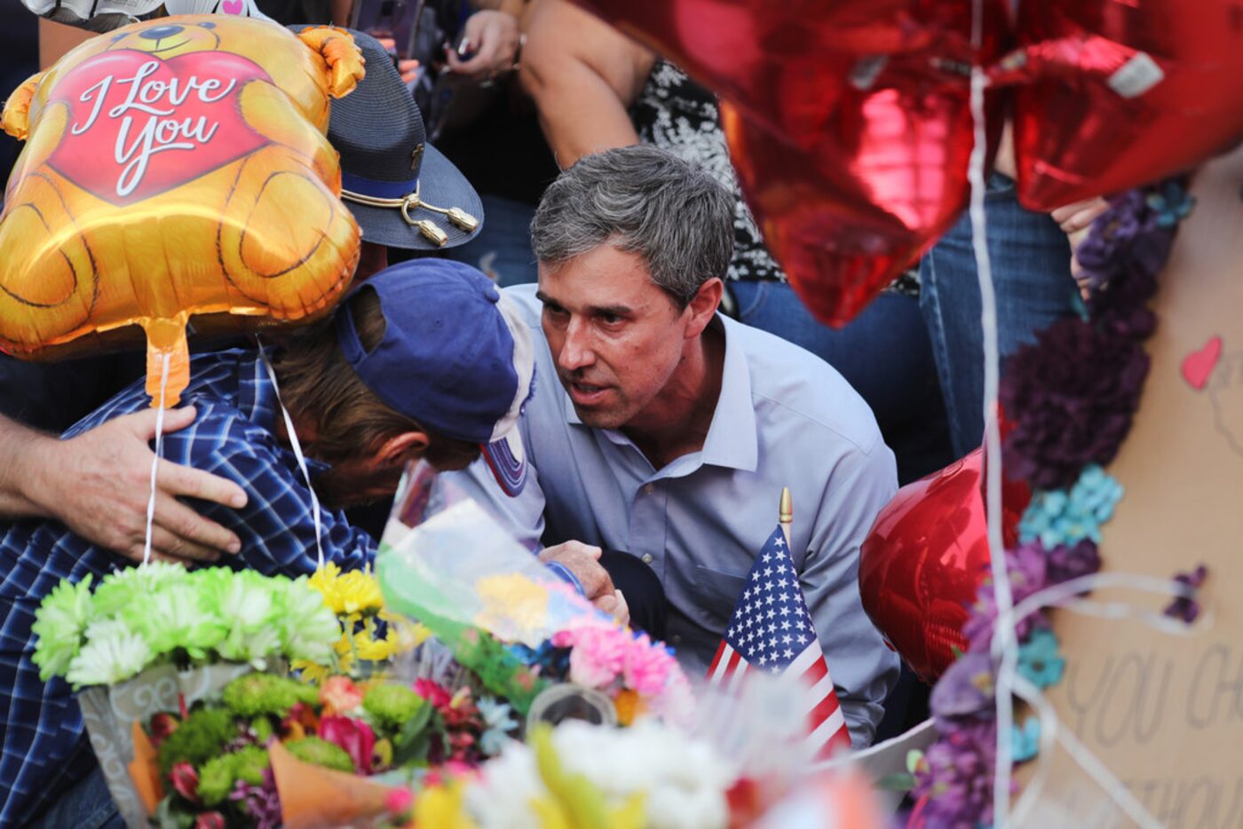 Democratic presidential candidate and former Rep. Beto O'Rourke consoles Antonio Basbo, who...