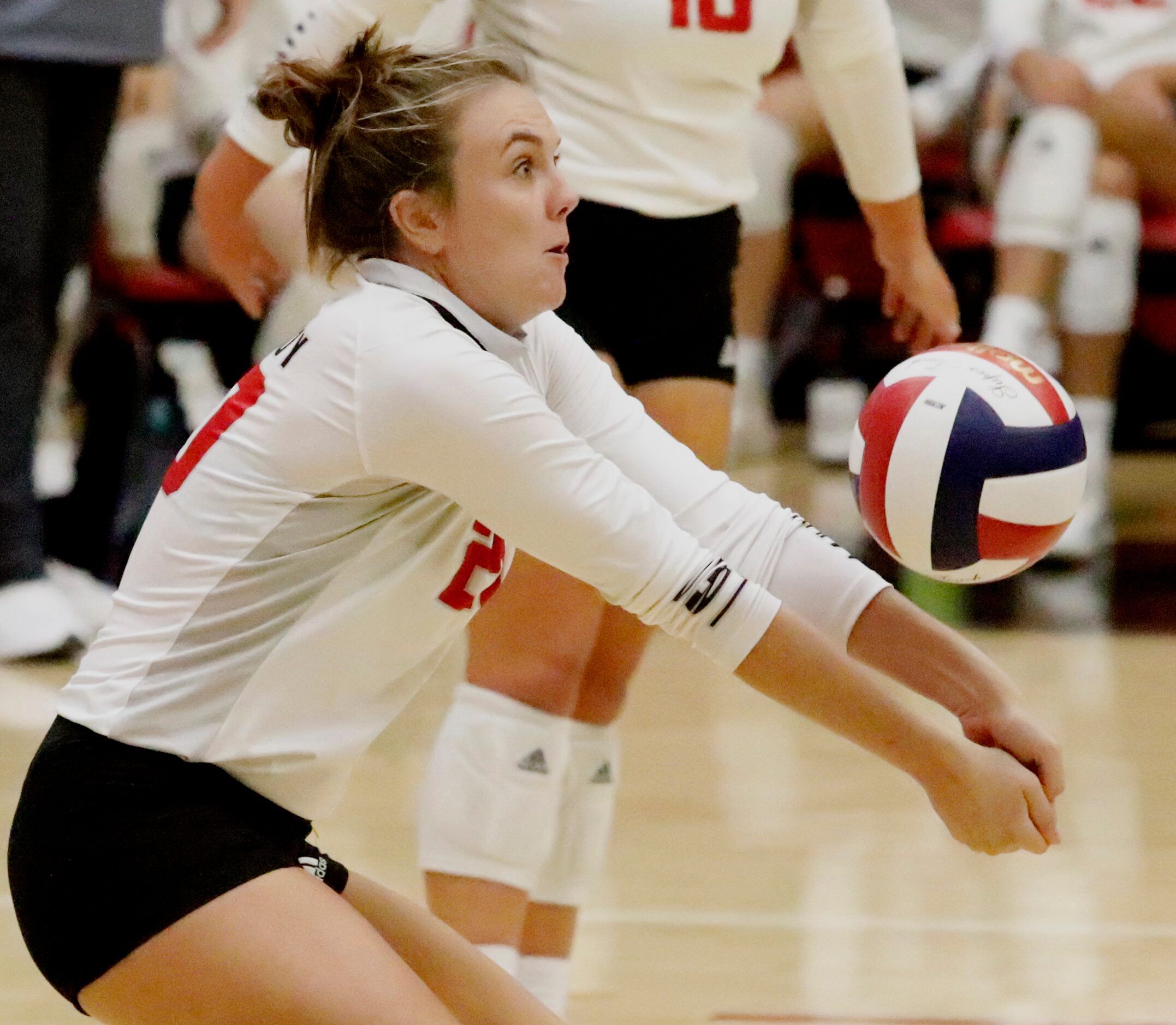 Lovejoy High School outside hitter Kylee Fitzsimmons (20) receives a serve during game one...