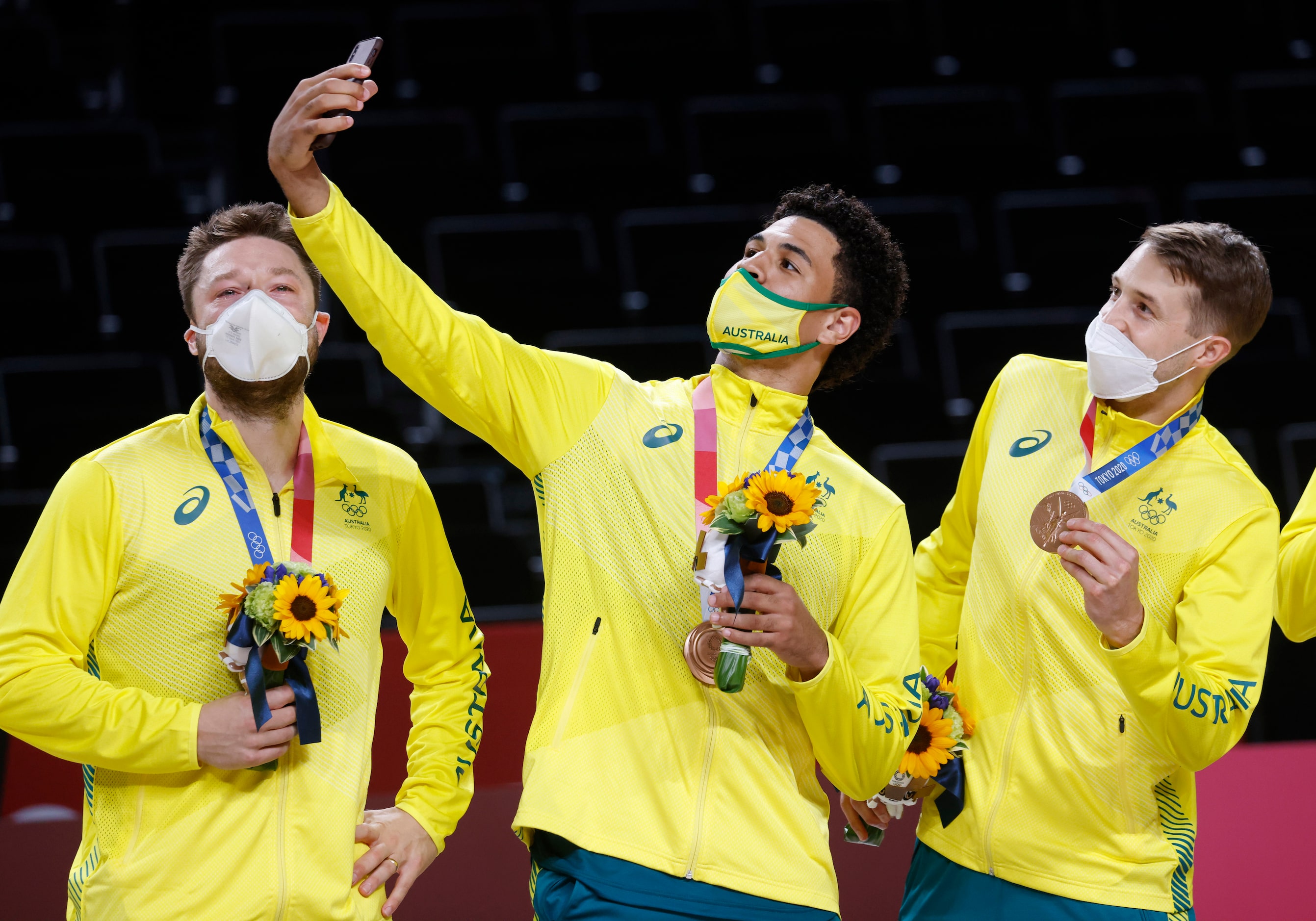 Australia’s Matthew Dellavedova (8, left) looks on as Josh Green (6, center) and Nathan...