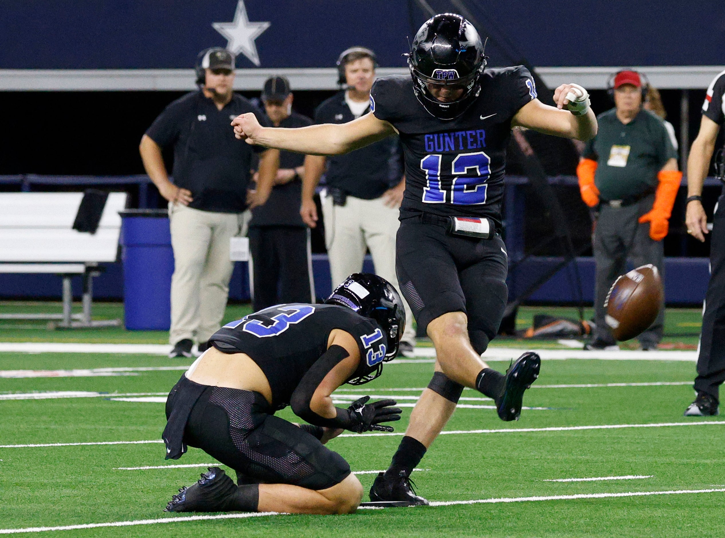 Gunter's  Preston Tarpley (12) scores an extra point against Woodville in the second half of...