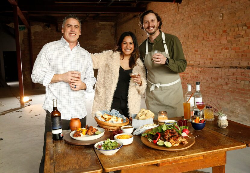 Co-owners Glen Keely, (from left) Sarah Castillo and Christian Lehrmann smile inside the...