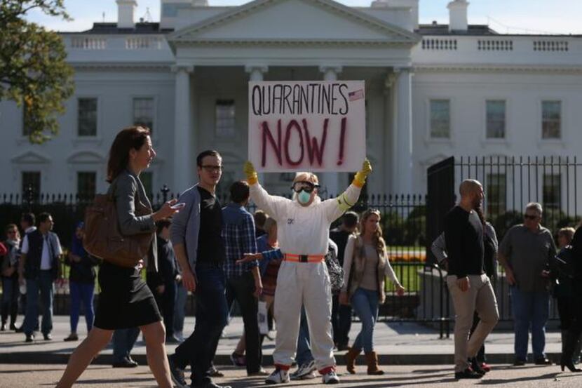 A demonstrator at the White House last month advocated a mandatory quarantine for people...