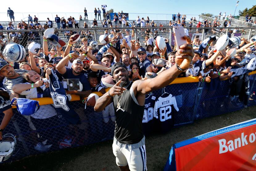 Dallas Cowboys wide receiver Dez Bryant (88) films himself and fans for a Cowboys social...