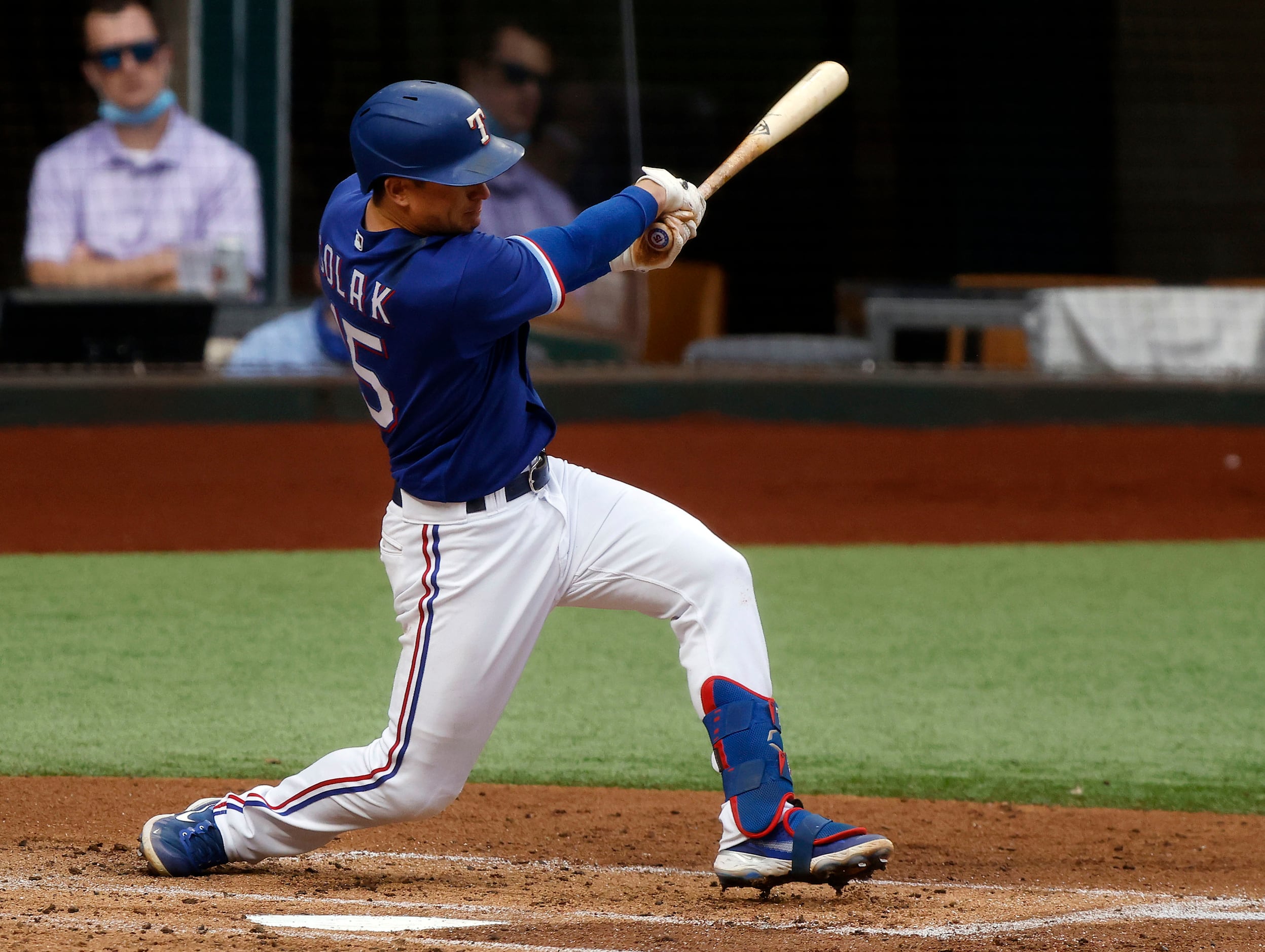 Texas Rangers second baseman Nick Solak (15) singles to left against the Milwaukee Brewers...