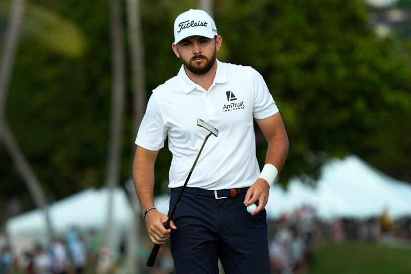 Hayden Buckley walks off the 18th green after making his putt during the third round of the...