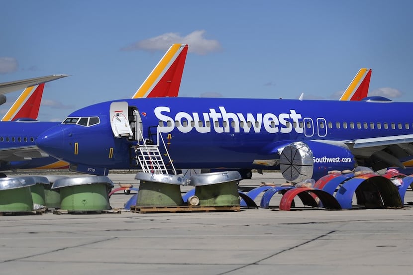 Southwest Airlines Boeing 737 MAX aircraft are parked on a tarmac after being grounded in...