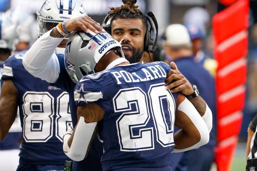 Dallas Cowboys running back Ezekiel Elliott congratulates Tony Pollard on his touchdown...
