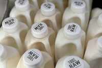 Bottles of raw milk are displayed for sale at a store in Temecula, Calif., on Wednesday, May...