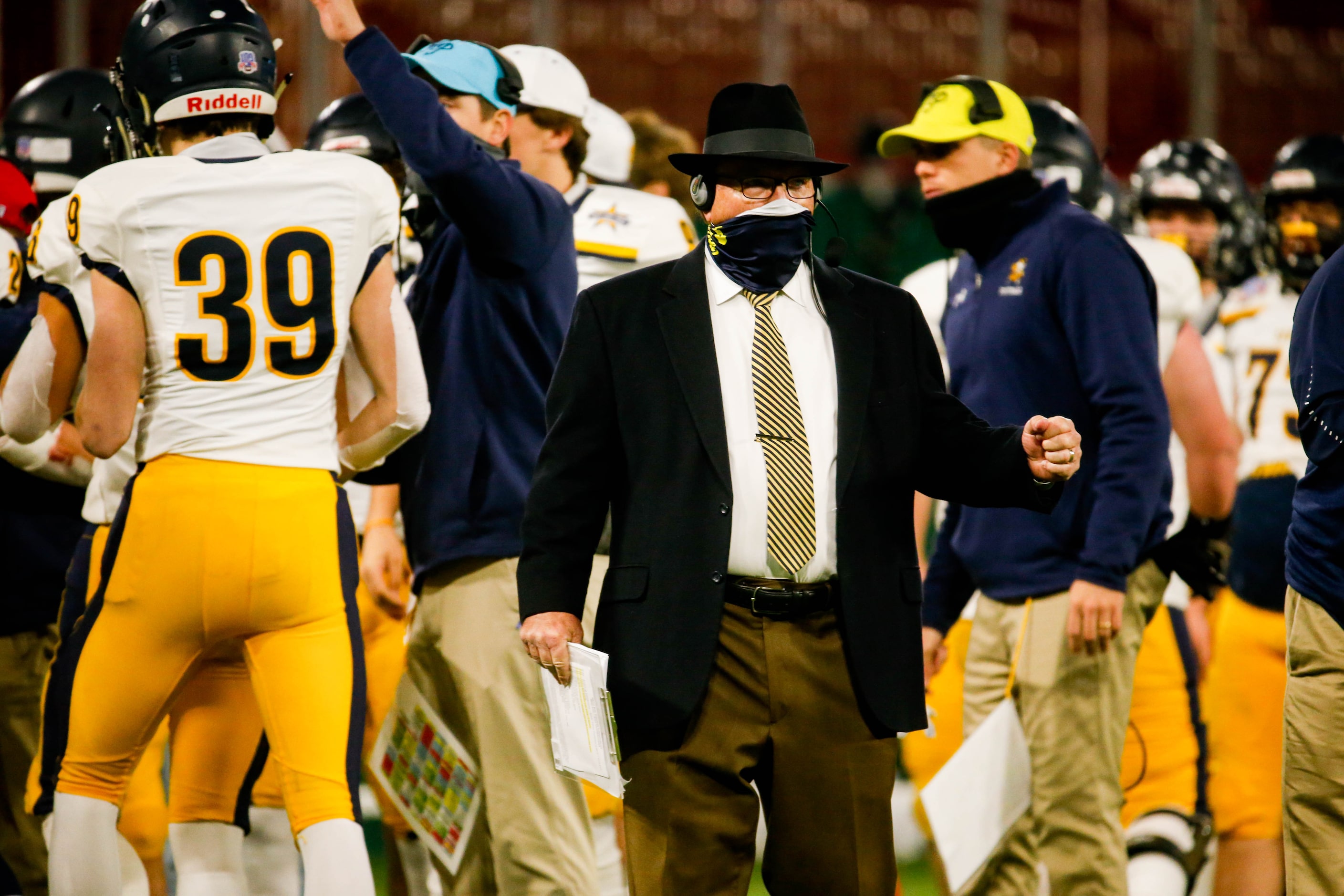 Highland Park coach Randy Allen watches from the sideline during the first half of a Class...