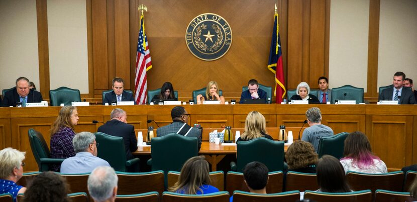 Trenton Johnson (center, at the table) and others voiced their opinions on the bathroom bill...