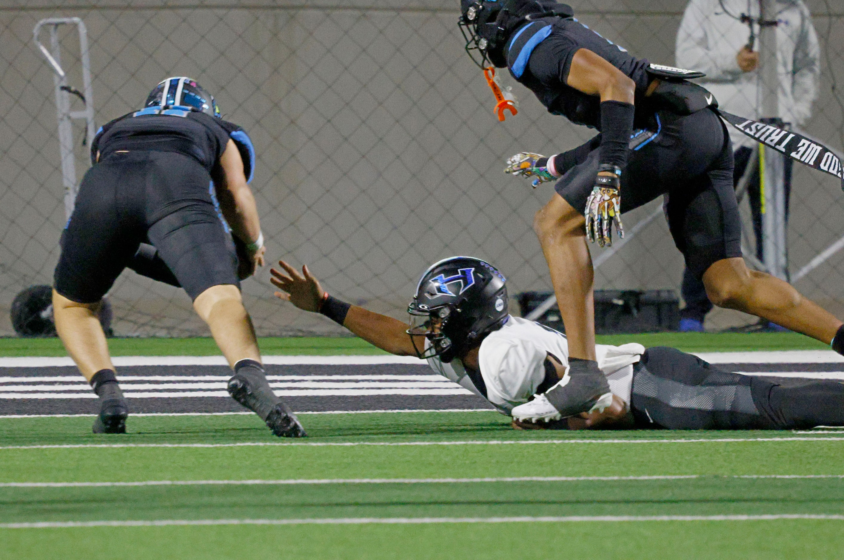 Rock Hill's Max Wrobel (11), left, scores a touchdown after picked up the ball that Hebron's...