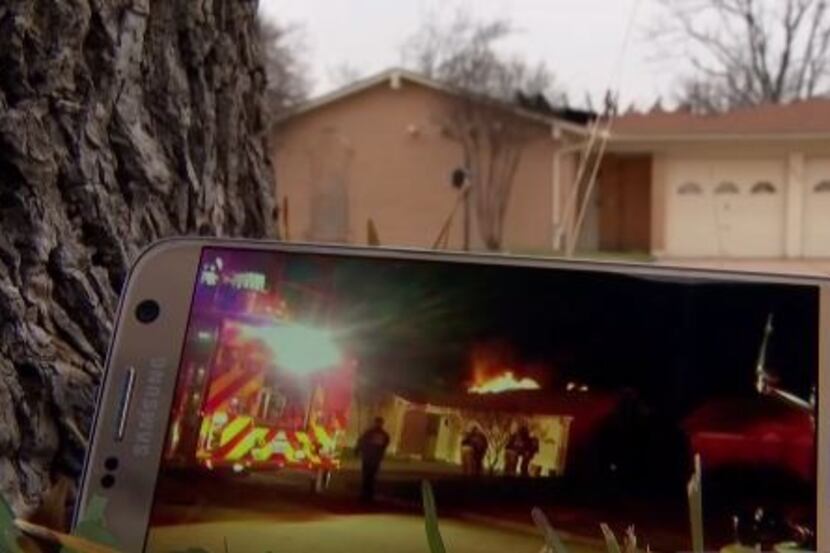 Video through a smartphone captured images of a fire as it burned at a Hurst home last year....