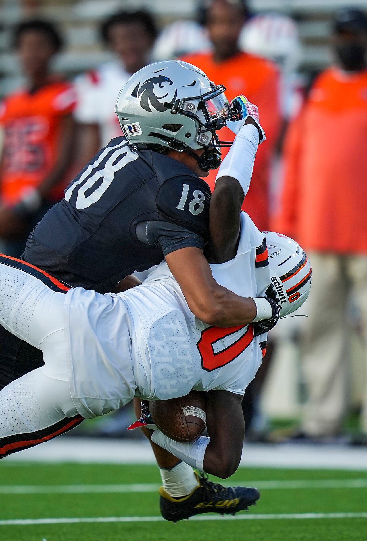 Lancaster wide receiver Ti'Erick Martin (0) is brought down by Denton Guyer defensive back...