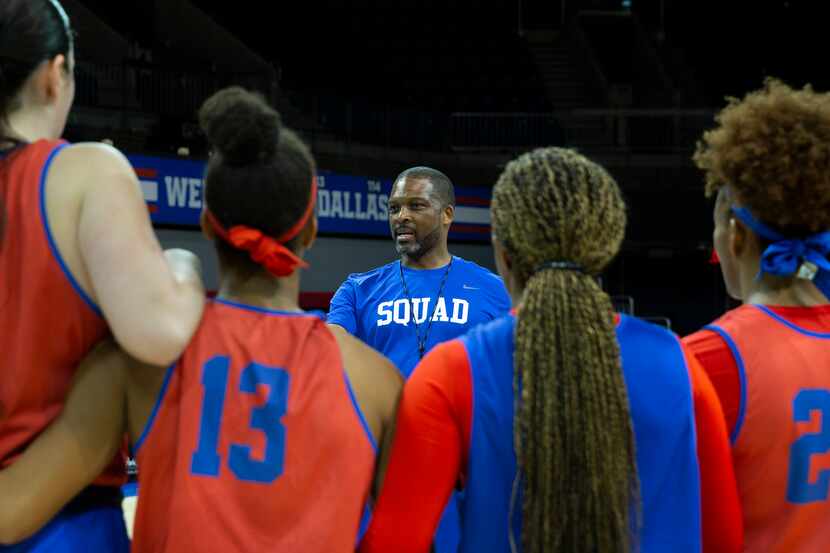 Travis Mays, head coach of SMU women's basketball, gives final directions to his players to...