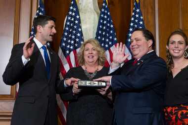 House Speaker Paul Ryan of Wis. administers the House oath of office to Rep. Blake...