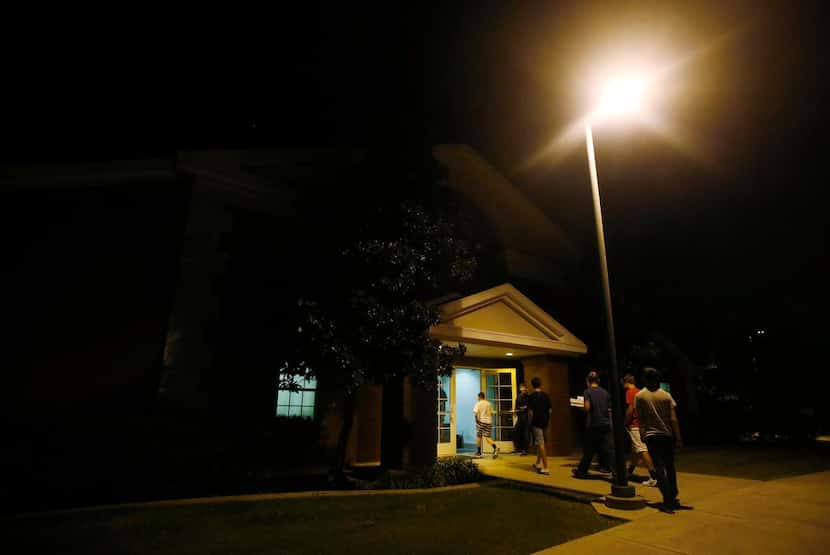 
Students arrive in darkness to attend the 6 a.m. seminary classes. 
