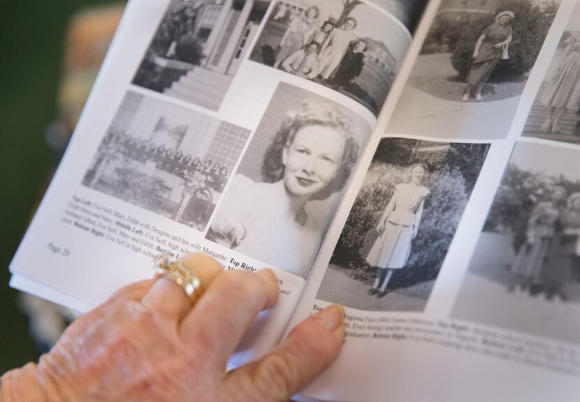 Eva Jackson points to two pictures of her as a young woman in a book she wrote about her life.