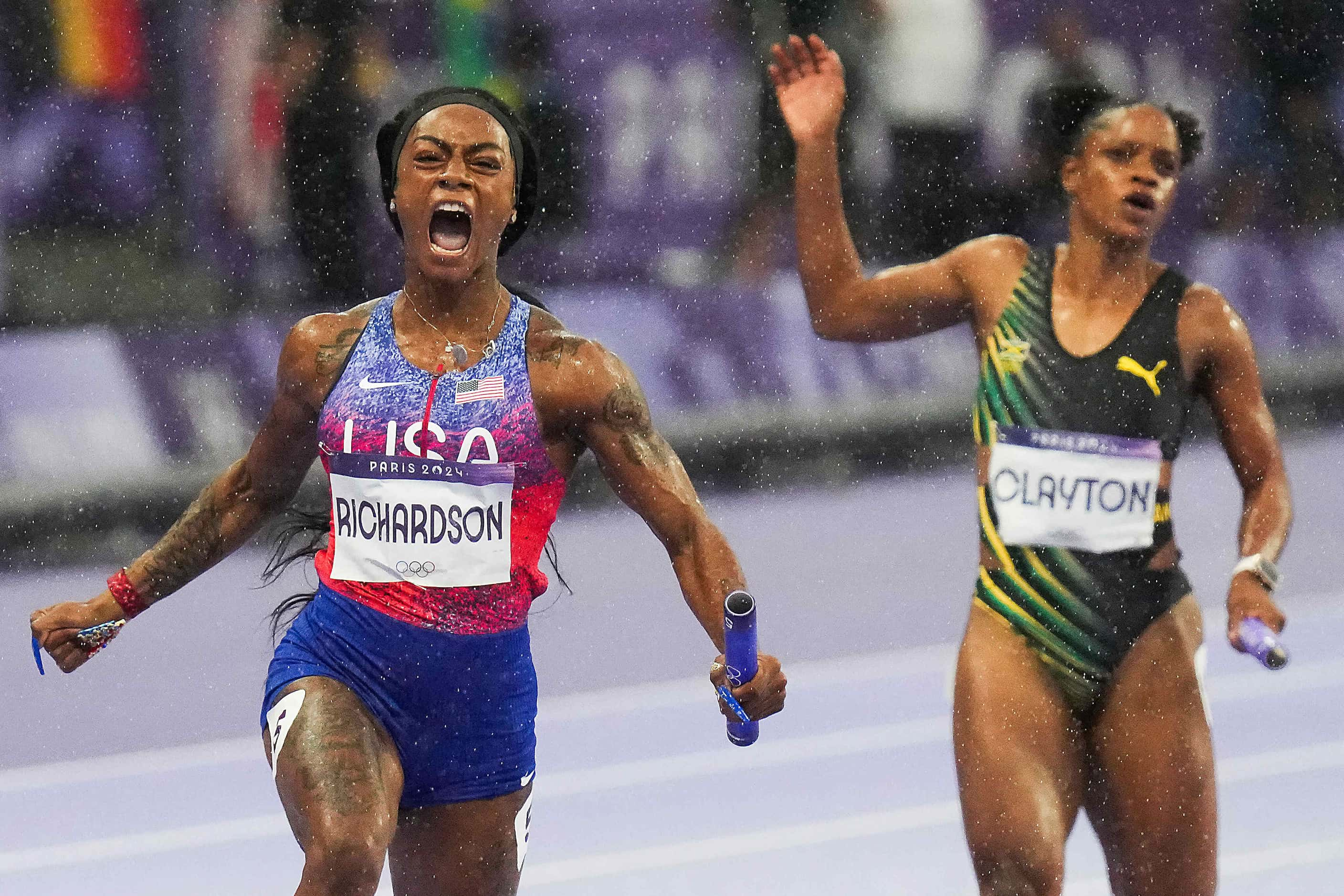 Sha'carri Richardson of the United States crosses the finish line to win the women's 4 x 100...