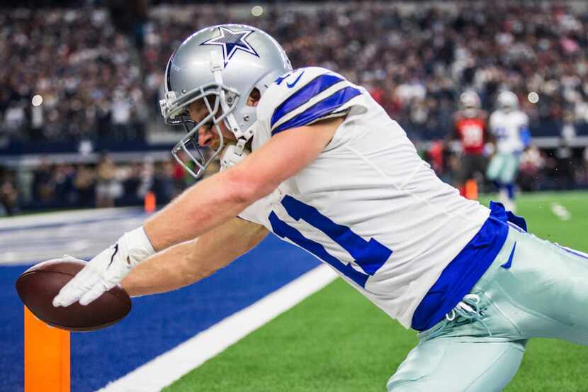 FILE - Dallas Cowboys wide receiver Cole Beasley (11) dives toward the goal line out of...