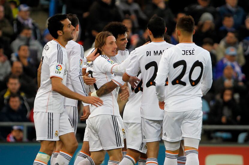 Real's Luka Modric, 3rd left, celebrates his goal with teammates during a Spanish La Liga...