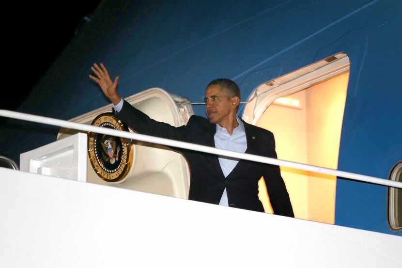 President Barack Obama, waving as he boards Air Force One en route to the Netherlands, has...