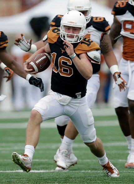 FILE - In this April 16, 2016, file photo, Texas quarterback Shane Buechele (16) scrambles...