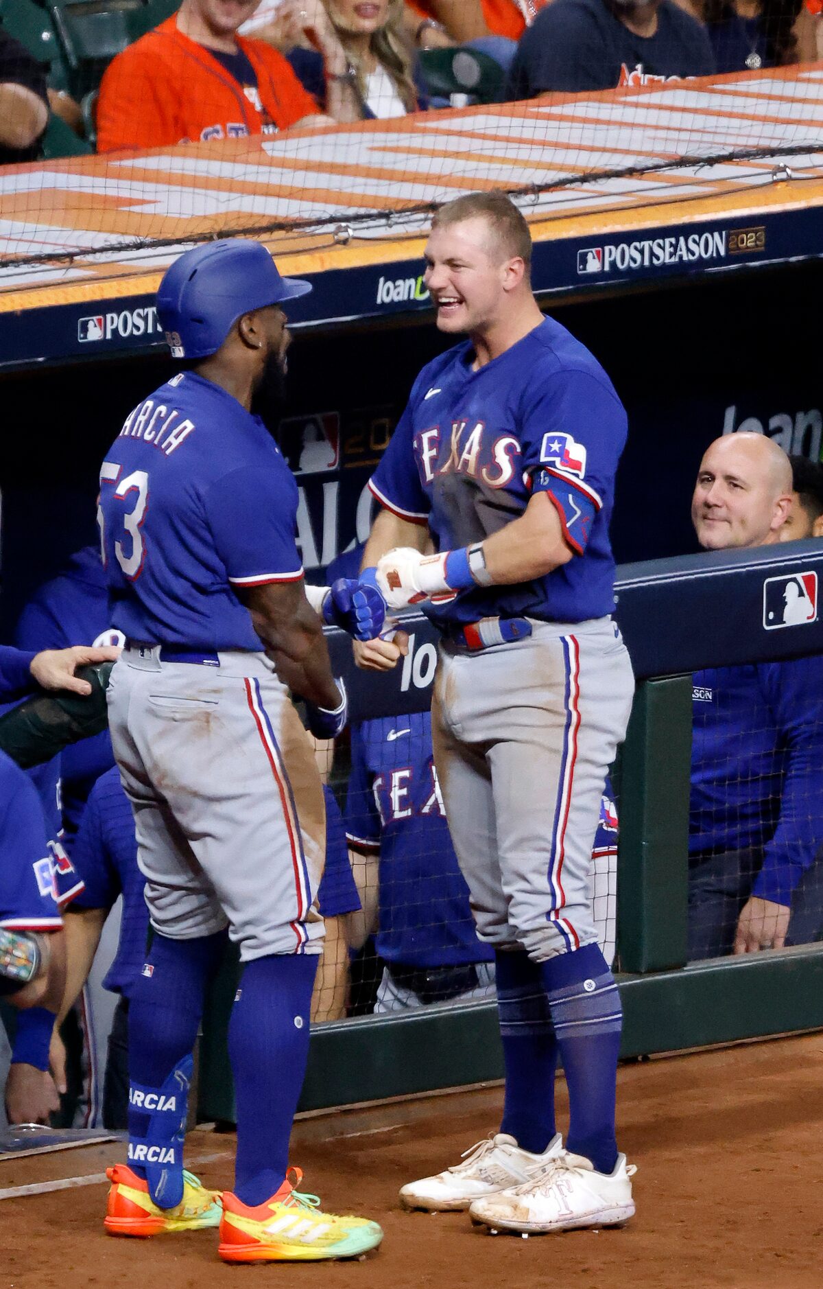 Texas Rangers Adolis Garcia (53) is congratulated by teammate Josh Jung (6) after hitting a...