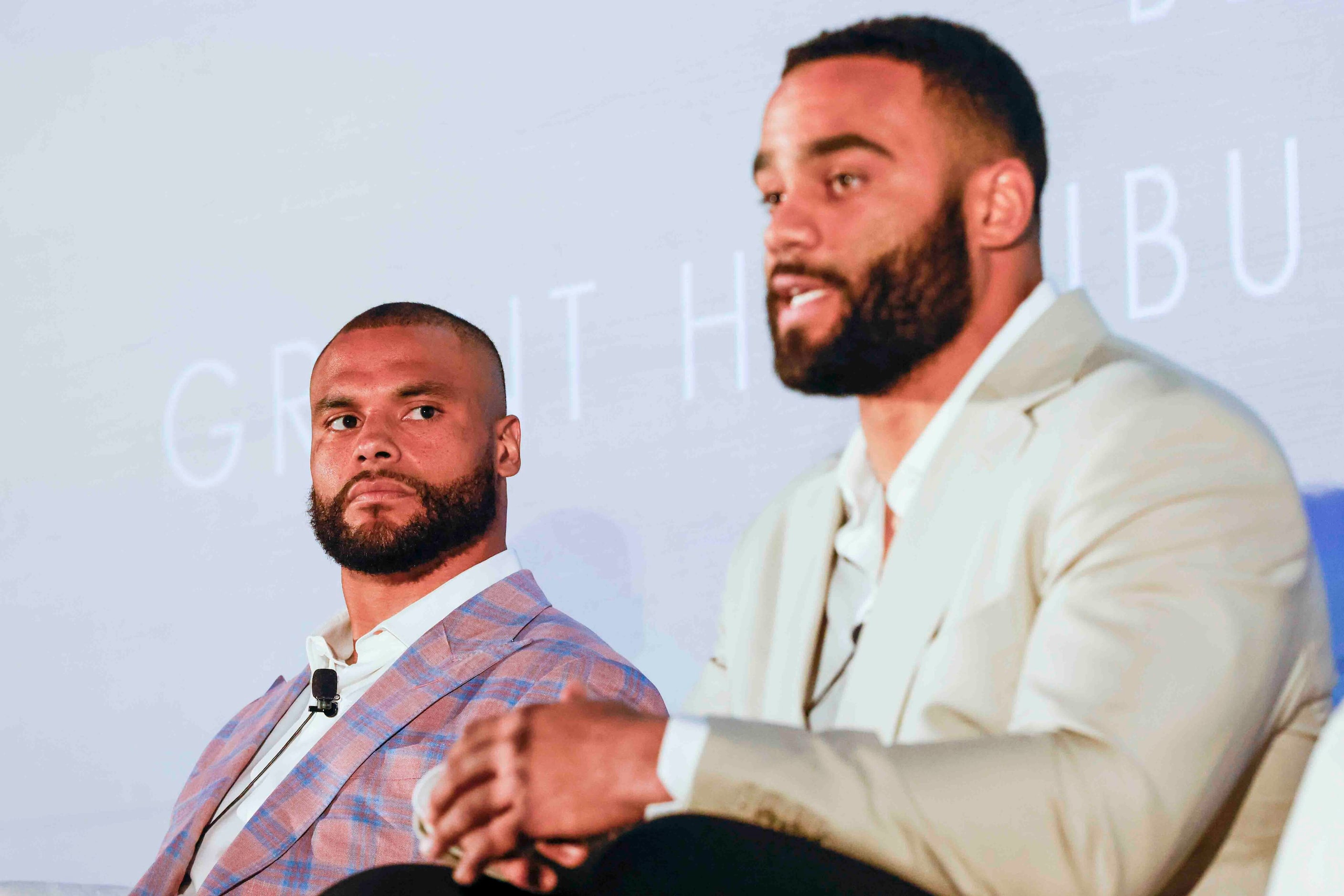 Cowboys QB Dak Prescott (left) listens to Solomon Thomas of the New York Jets during the...