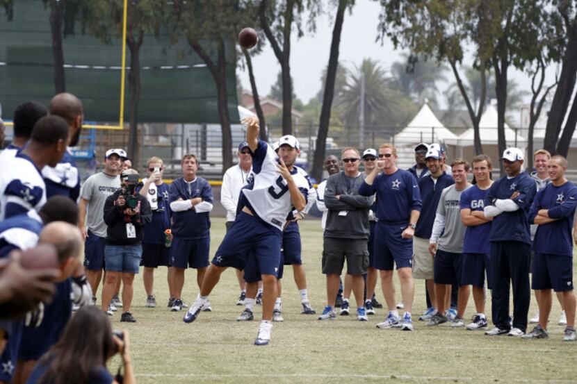 Dallas Cowboys quarterback Tony Romo (9) attempts to hit the crossbar of the field goal post...