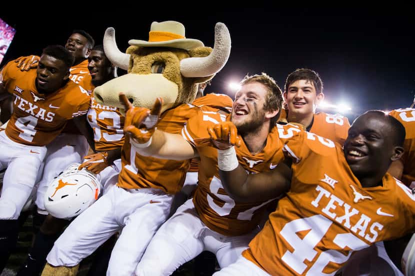 The Texas Longhorns celebrate a 37-14 win over the USC Trojans on Saturday, September 15,...