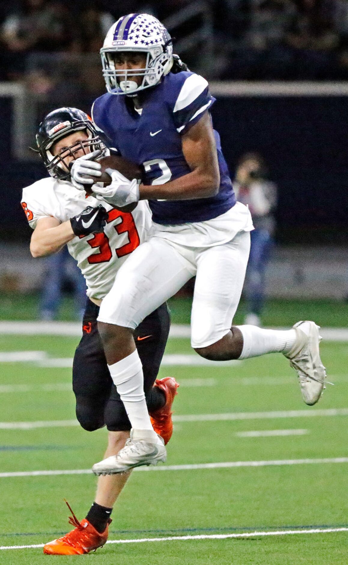 Richland High School wide receiver Kenneth Reeves II (2) catches a pass in front of Aledo...