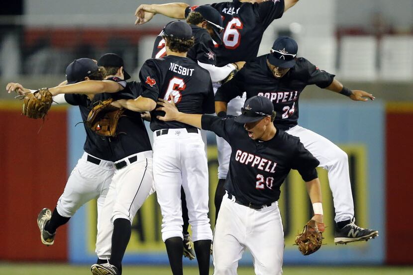 The Coppell baseball team celebrates their win over Flower Mound in their UIL Class 6A...
