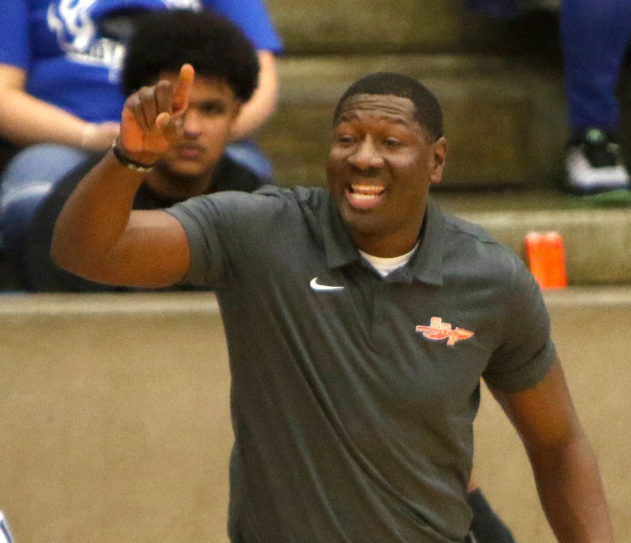 South Grand Prairie head coach Brandon Bennett directs his players during second half action...