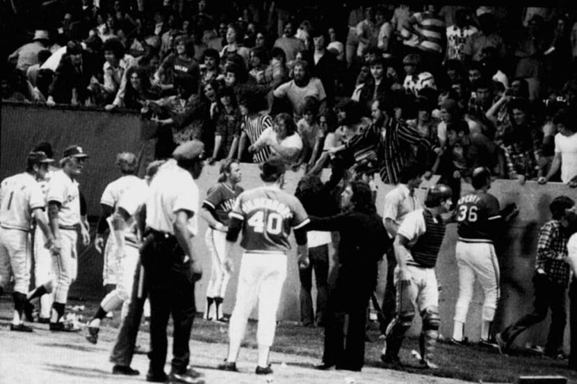 ORG XMIT: S119DC059 June 4, 1974 -- 'Ten Cent Beer Night' in Cleveland led to fans charging...