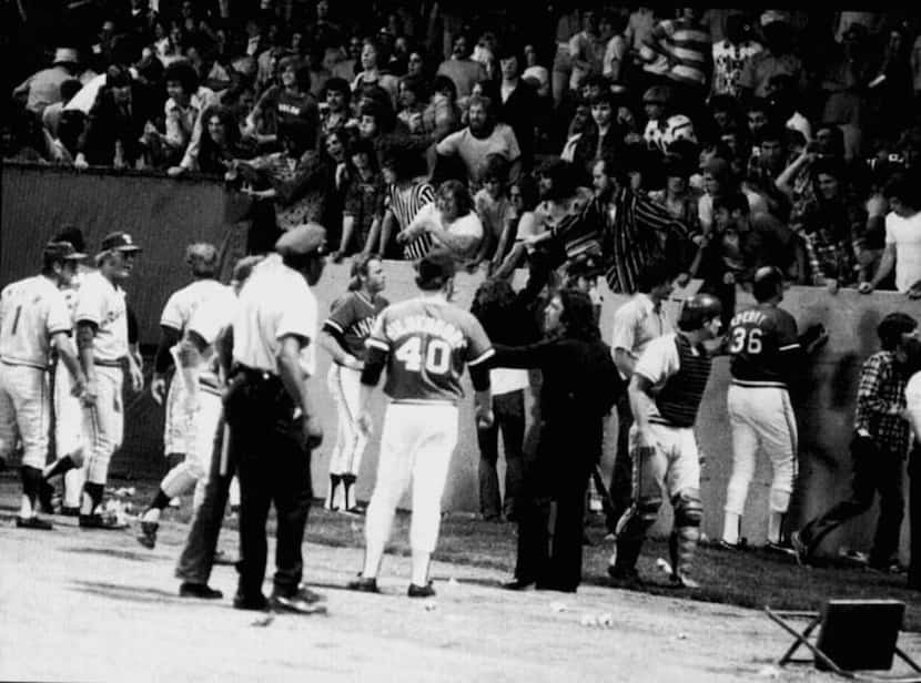 ORG XMIT: S119DC059 June 4, 1974 -- 'Ten Cent Beer Night' in Cleveland led to fans charging...