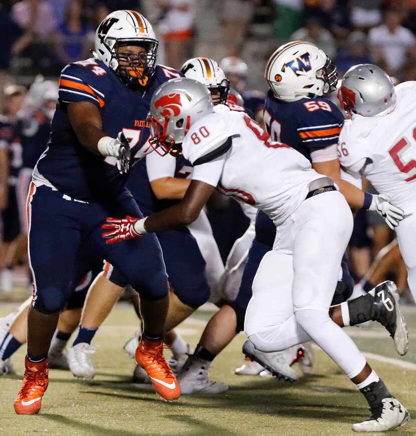 Wakeland High School Rafiti Ghirmai (74) blocks Woodrow Wilson High School defensive end...