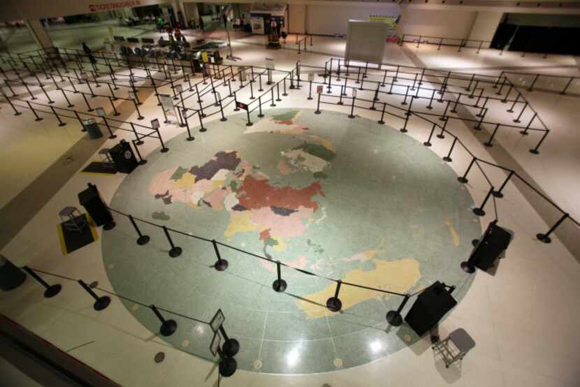 A map of the world covers the floor of the main lobby area at Dallas Love Field. A 2006...