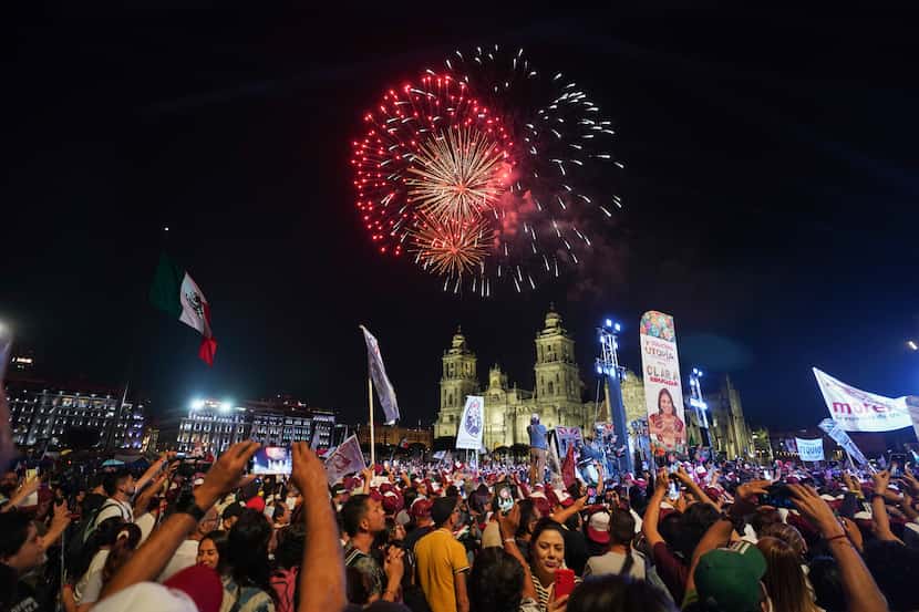 Fireworks go off as supporters of President-elect Claudia Sheinbaum celebrate at the Zocalo,...